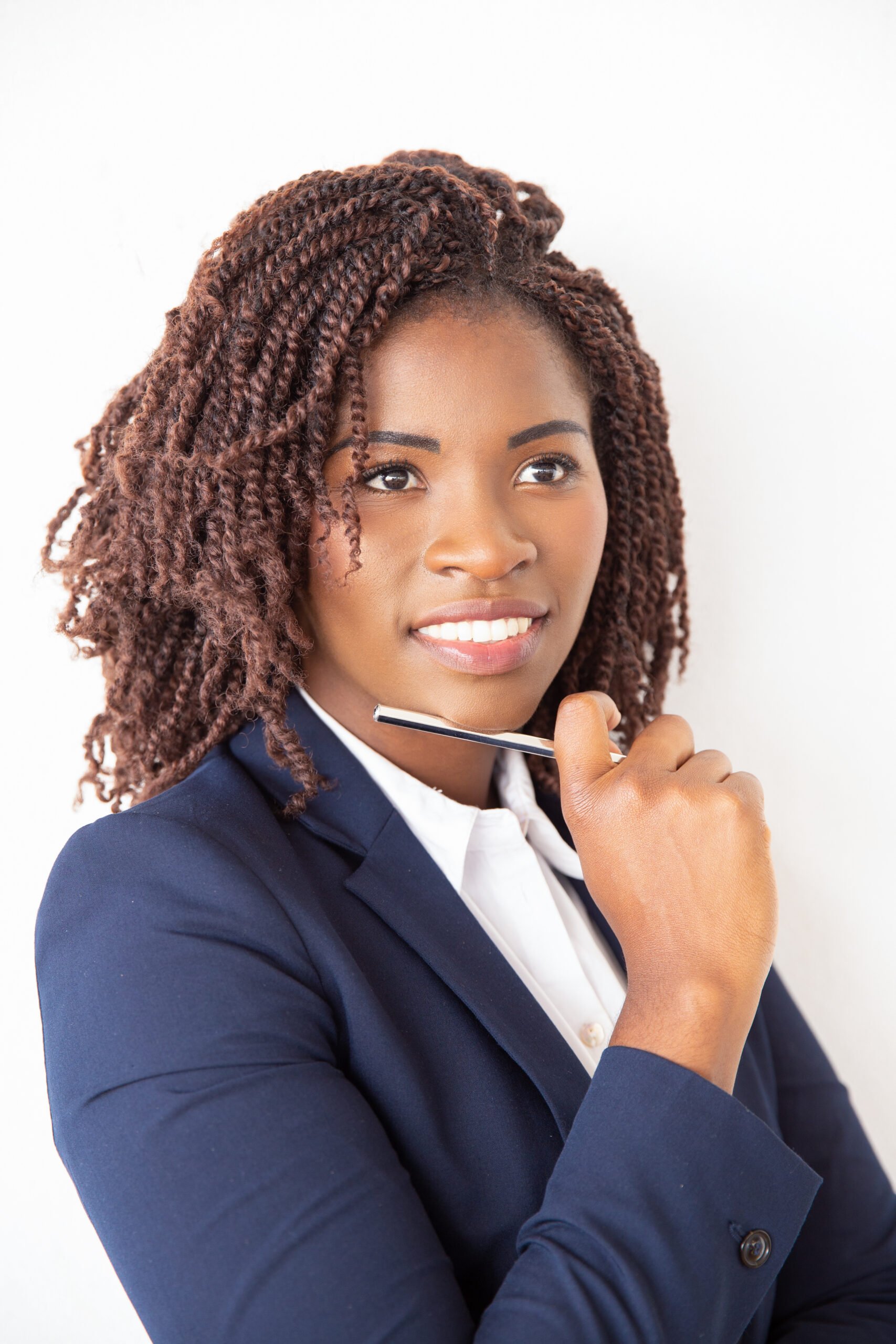 Happy female student holding pen, looking away. Young African American business woman standing isolated over white background. Female business portrait concept